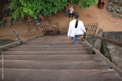 Wallpaper Mural Young woman walking down stairs at temple Torontodigital.ca