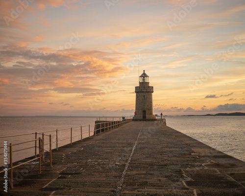 Fotografie lighthouse on the pier at Sunrise Guernsey