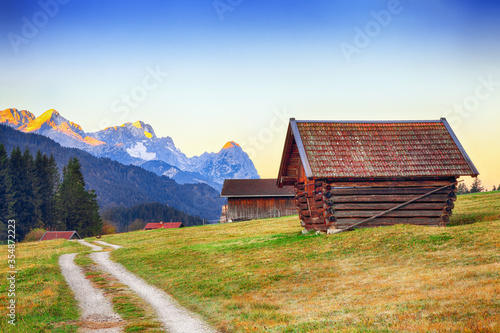 Fantastic view of alpine valley with wooden huts near Wagenbruchsee (Geroldsee) lake