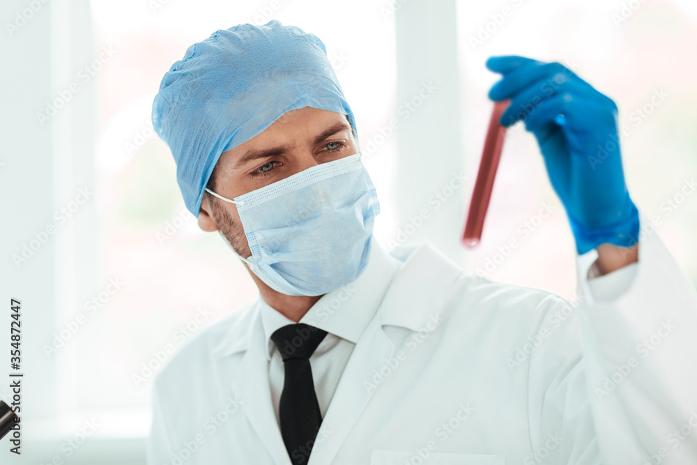 close up. test tube in the hands of a scientist. close up. test tube in the hands of a scientist.
