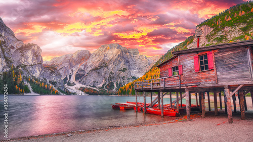 Photos Dramatic scenery of famous alpine lake Braies at autumn during sunset