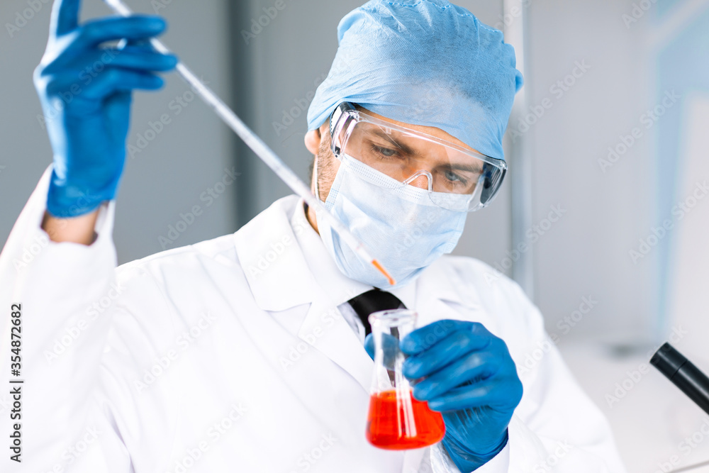close up. scientist testing blood in the lab. close up. scientist testing blood in the lab.
