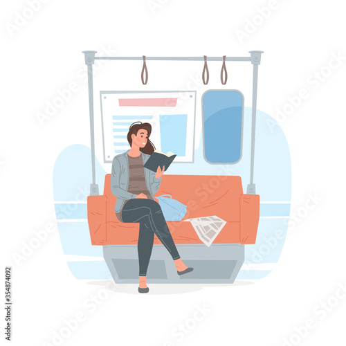 Modern woman reading book in underground train