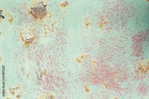 peeling paint metal rust, corrosion, texture of a metal wall, with traces of rust. Abstract dirty metal background. Wallpaper. Free space pattern. Old metal textured tile.
