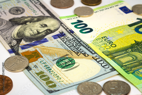 Dollars and euros. Banknotes 100 euros and dollars,bank capital,different coins 