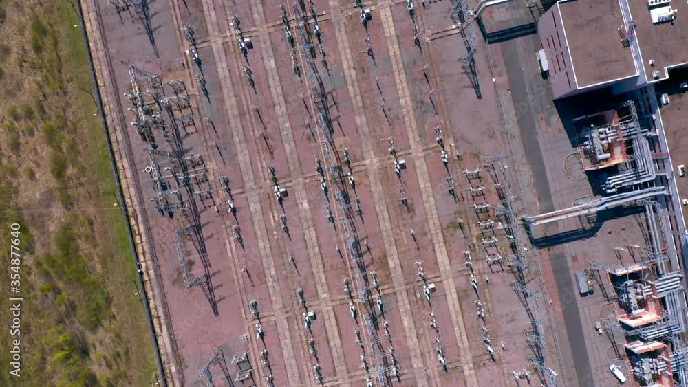 Aerial view of an electrical substation. Power lines view from above. Industrial power supply for a big city. Aerial view of an electrical substation. Power lines view from above. Industrial power supply for a big city.
