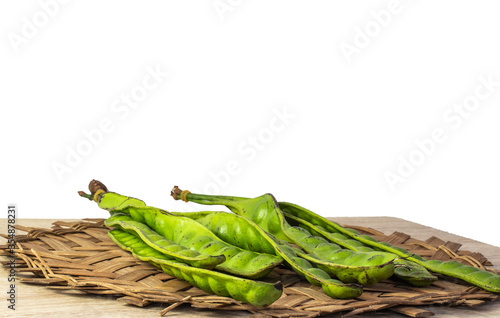 The bitter beans are placed on a bamboo weave. This kind of vegetable is famous in South of Thailand. Healthy concept