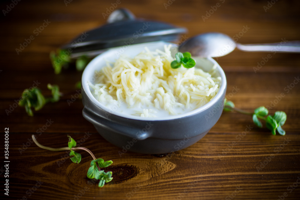 sweet boiled vermicelli with milk in a ceramic bowl sweet boiled vermicelli with milk in a ceramic bowl