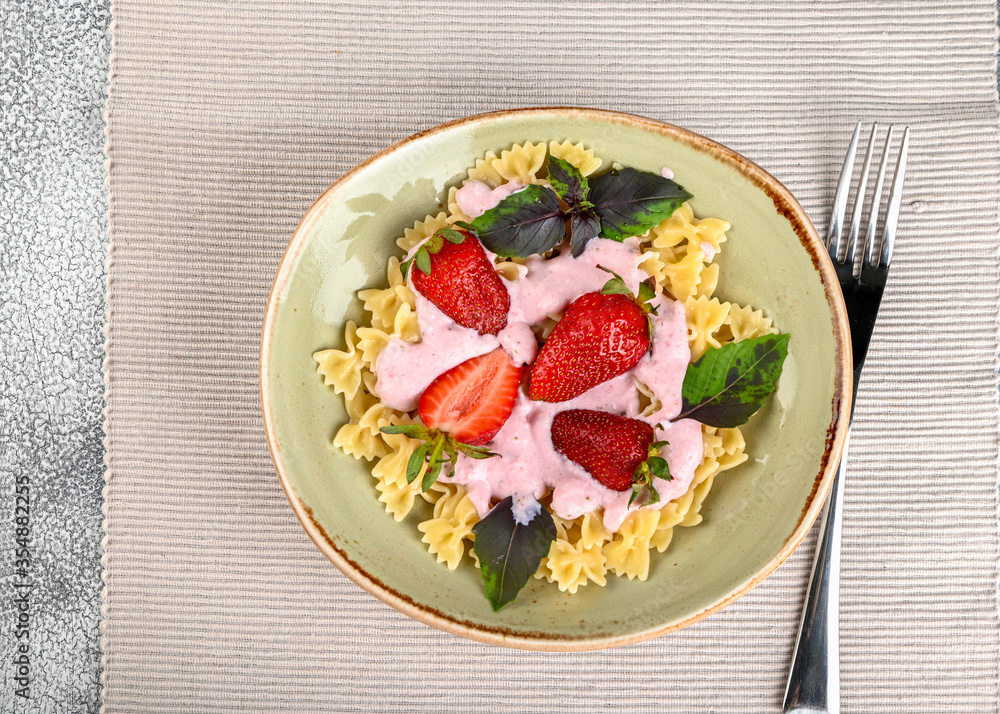 Pasta with strawberry cream and fresh strawberries and basil Pasta with strawberry cream and fresh strawberries and basil