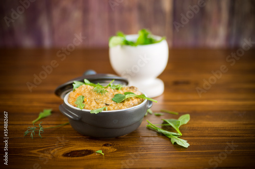 boiled bulgur groats with vegetables and herbs