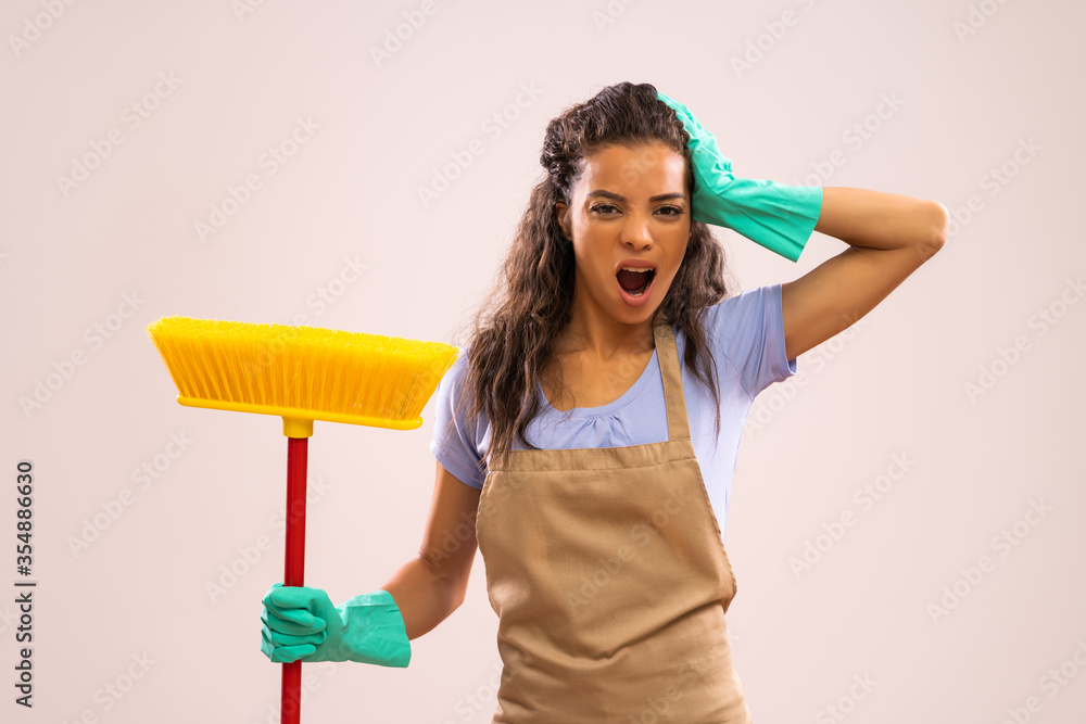 Portrait of african-american housewife who doesn't like cleaning. Portrait of african-american housewife who doesn't like cleaning.