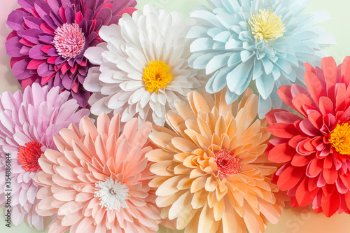 Colorful flowers paper background. Red, pink, purple, blue, white and peach handmade paper asters. Pastel colors © Ирина Алибаева