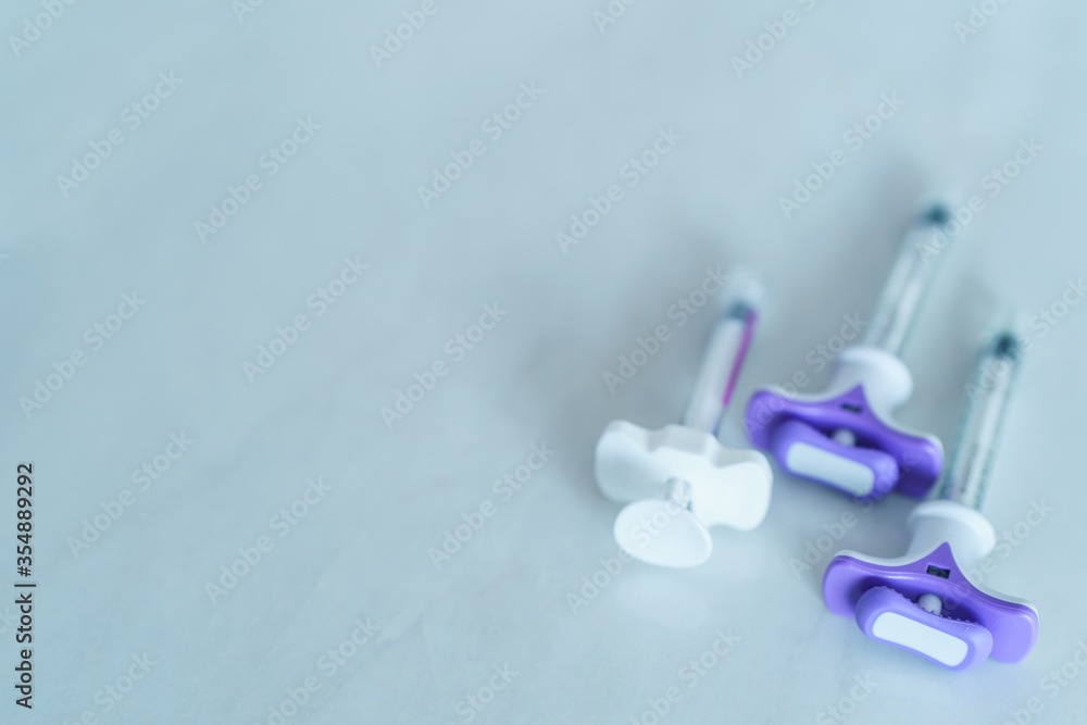 Group of plastic syringe for filler injection on white background. filler needle Group of plastic syringe for filler injection on white background. filler needle