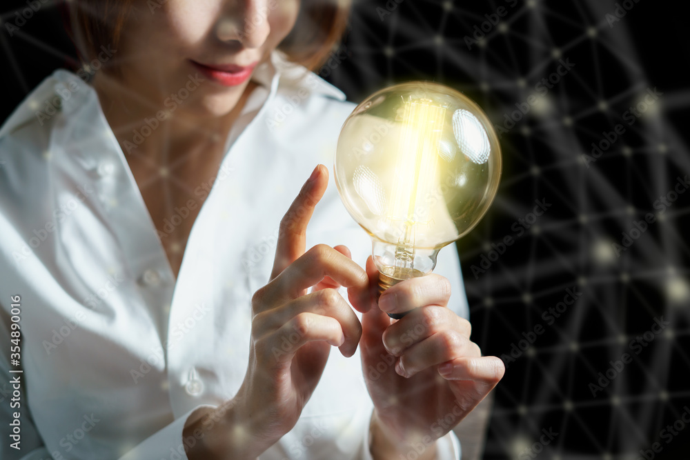 Woman hand holding light bulb. idea concept with inspiration. business connection idea. Woman hand holding light bulb. idea concept with inspiration. business connection idea.