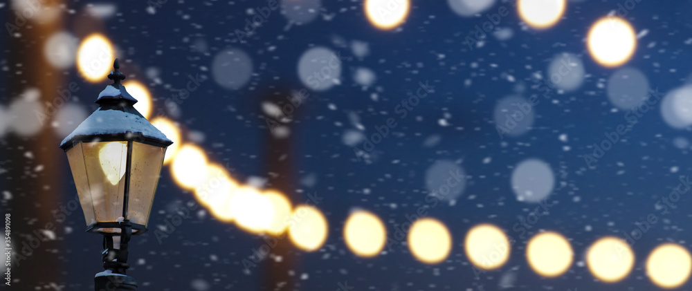 A Magical Old Street Lanterns Shines on the Street at snowy Night bokeh background.