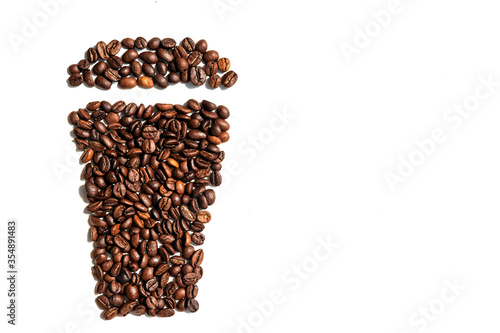 coffee beans in a shape of  glass of coffee. cup of coffe. morning concept. copy space.