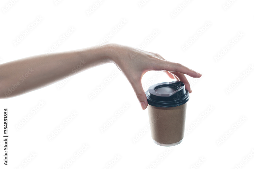 Woman hand holding a brown coffee paper cup isolated on white background. Woman hand holding a brown coffee paper cup isolated on white background.