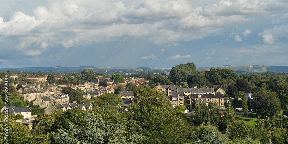 Scenic view of a beautiful town set amongst green leafy trees - namely the historic town of Bradford on Avon in Wiltshire England