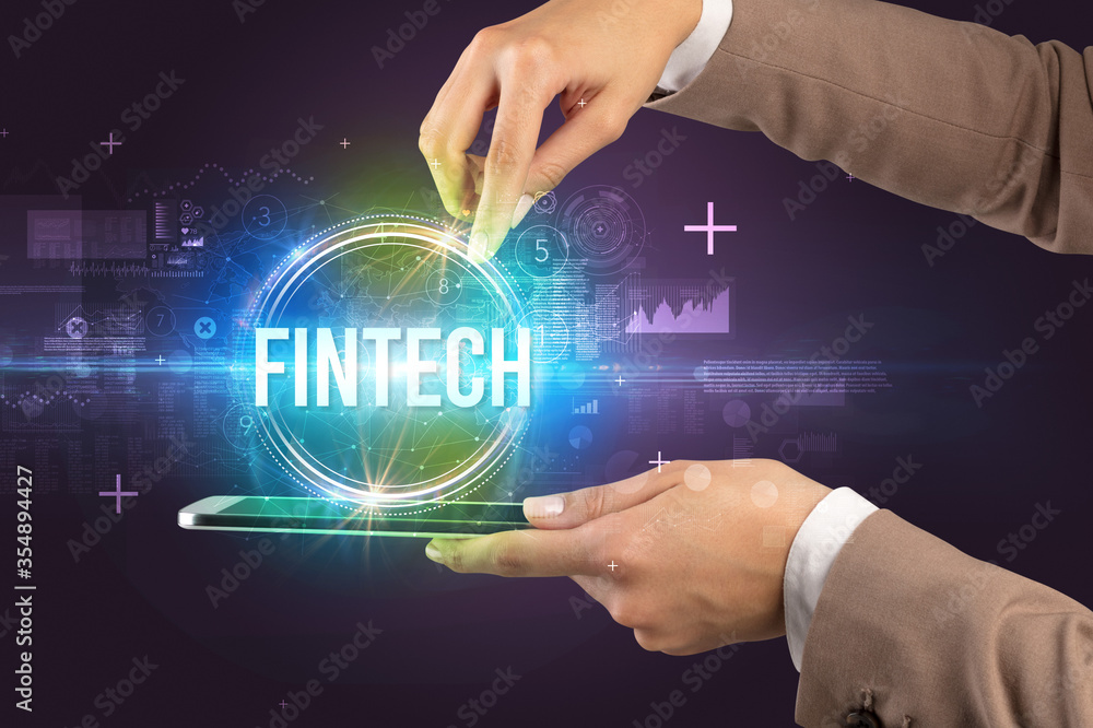 Obraz premium Close-up of a touchscreen with FINTECH inscription, new technology concept