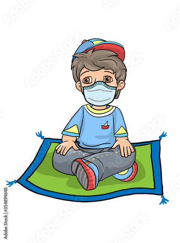 Little boy cross his legged sitting on fitness yoga floor mat in mask, learning at home. Student learn at home from school of the coronavirus pandemic. Childhood learning internet sport meditation