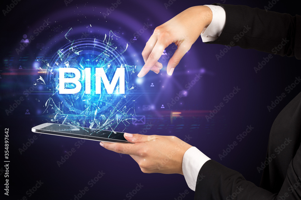 Close-up of a touchscreen with BIM abbreviation, modern technology concept Close-up of a touchscreen with BIM abbreviation, modern technology concept