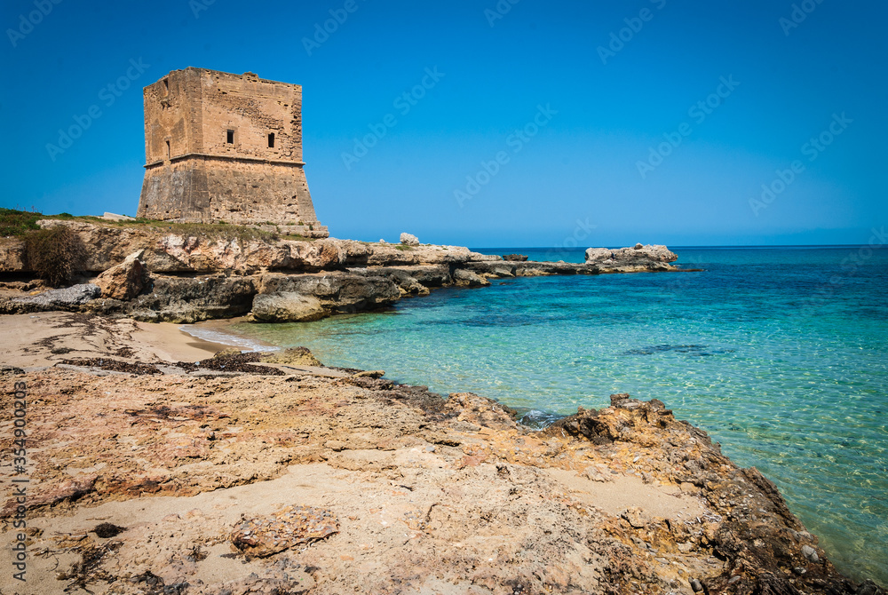 View of a cove of the Cinisi coast with ancient watchtower.
