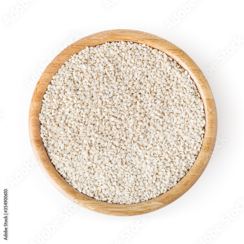 Sesame seeds isolated in wooden bowl on white background with clipping path