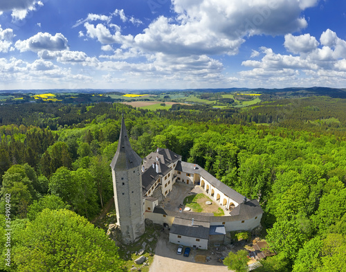 Gothic castle Rostejn near the village Doupe, stands on a rocky hill in the romantic landscape, Czech Republic photo