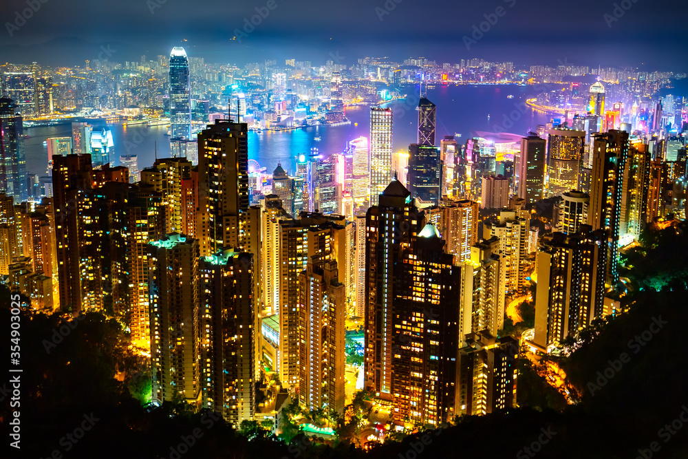 Obraz premium Hong Kong skyscrapers skyline cityscape view from Victoria Peak illuminated in the evening. The most famous view of Hong Kong at twilight sunset. Hong Kong, special administrative region in China.