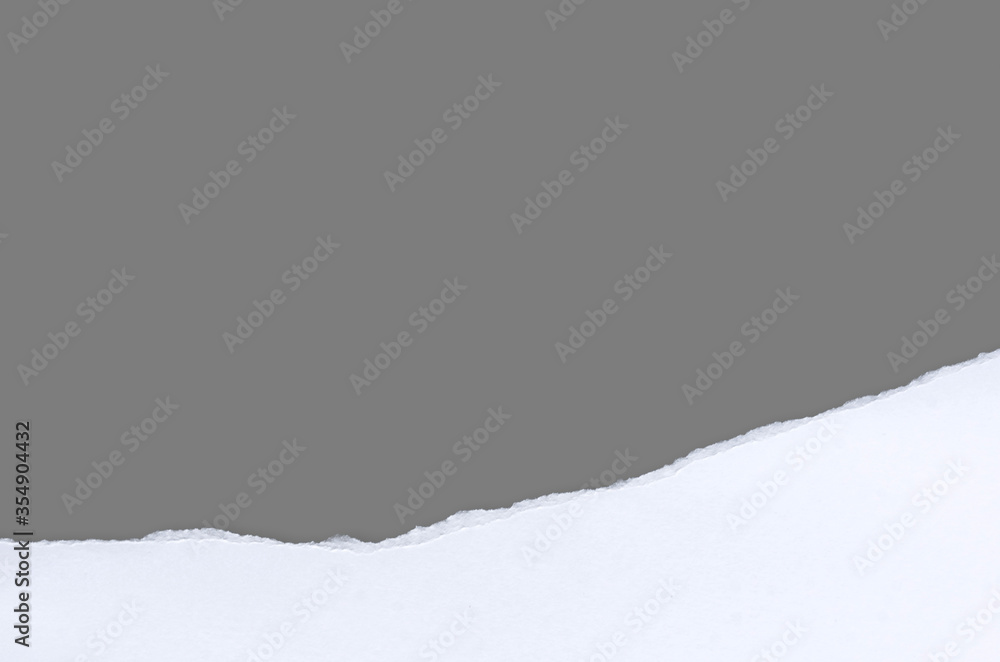 White ripped note paper, paper different shapes scraps isolated on gray background. with clipping path. White ripped note paper, paper different shapes scraps isolated on gray background. with clipping path.