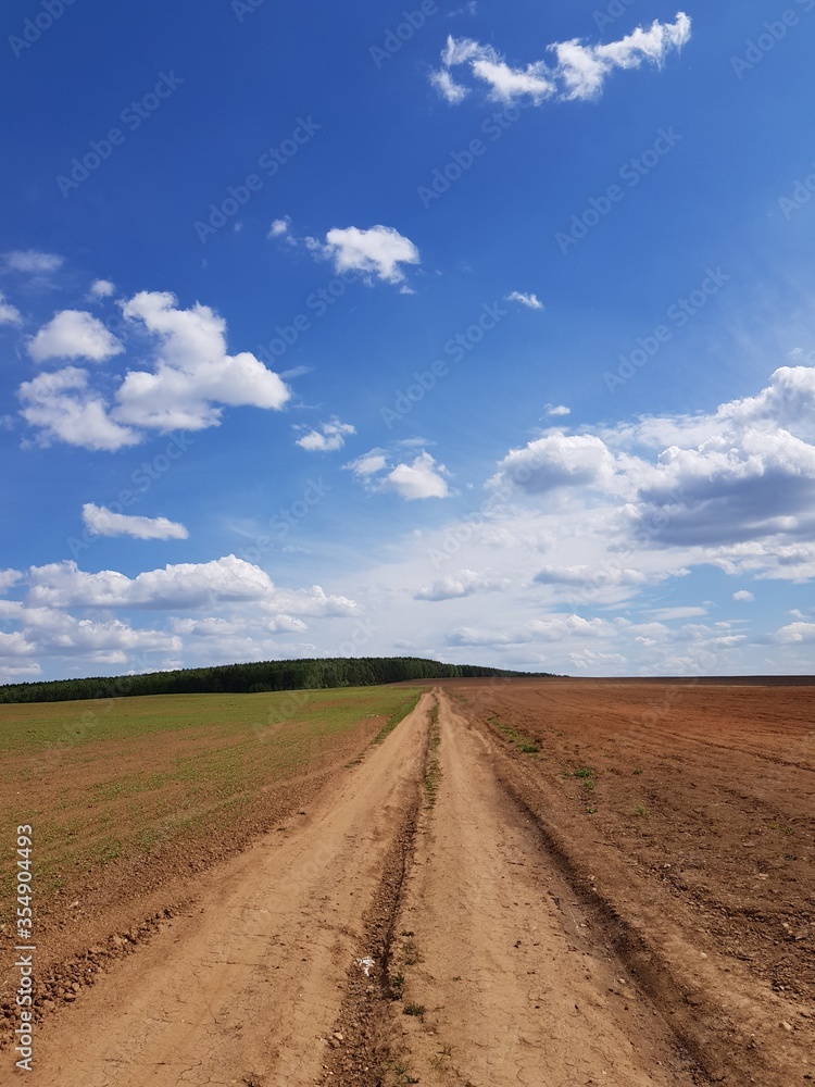 Country road under blue sky
