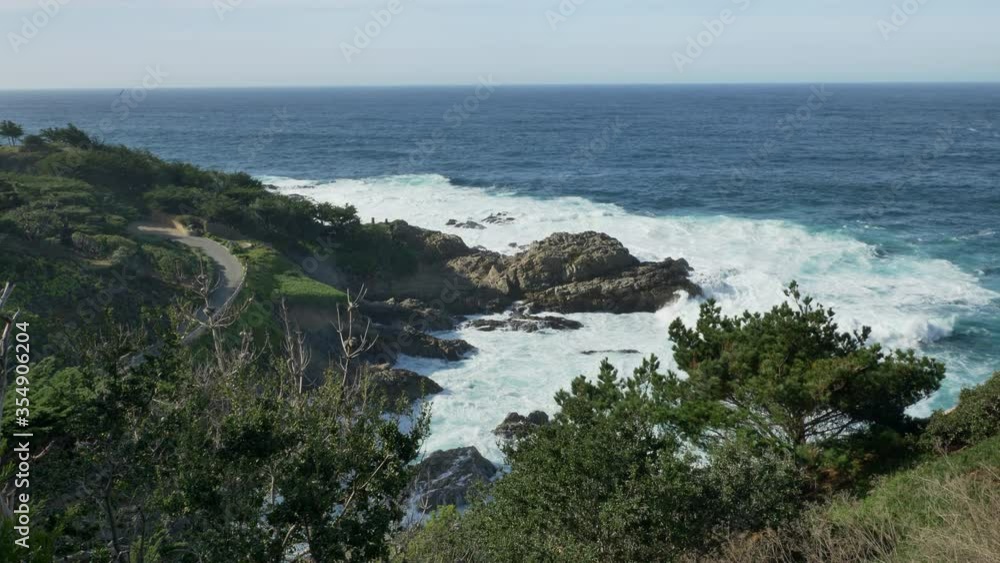 Majestic Big Sur coastline waves crashing on the cliff rocks at California's Highway 1 scenic drive Majestic Big Sur coastline waves crashing on the cliff rocks at California's Highway 1 scenic drive