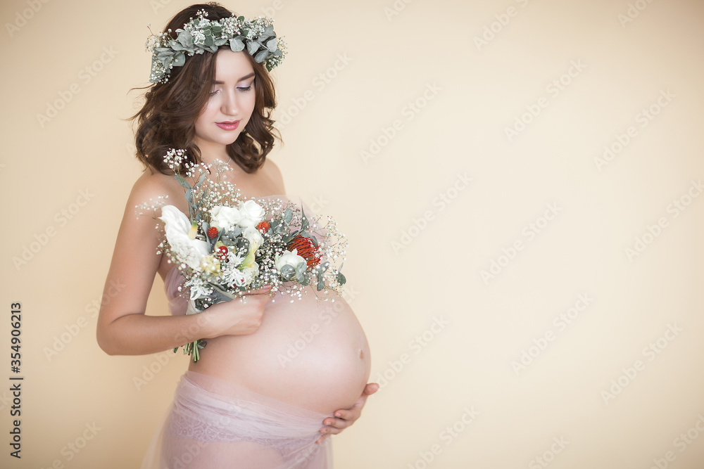 Young attractive pregnant woman at home. Close up picture of expecting female. Young attractive pregnant woman at home. Close up picture of expecting female.