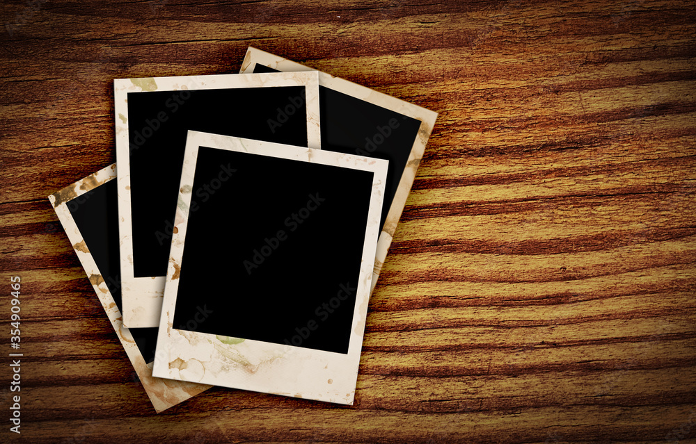 old photo frames on wood background old photo frames on wood background