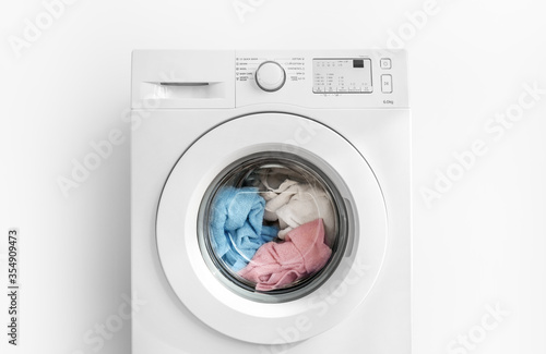 Bild auf Leinwand Working washing machine on white background