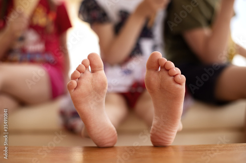 Children's bare feet. The bare heels of a young child. 