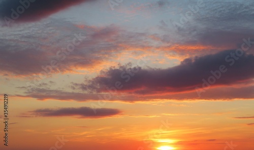 Beautiful orange burgundy sunset in the sky, natural background