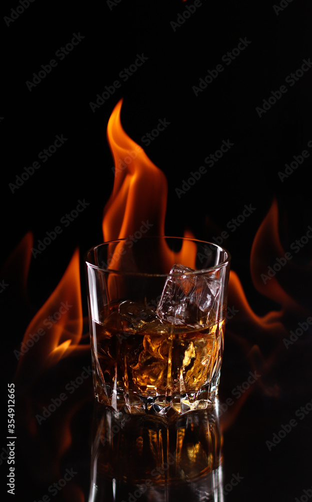 whiskey on fire on a dark background burning