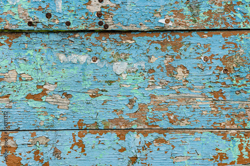 texture of wooden boards with peeling blue paint