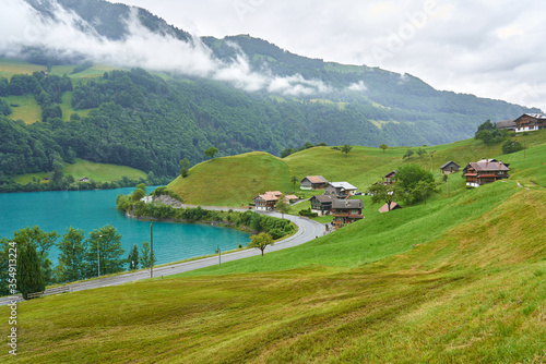 Landscape panorama with green nature in Lungern / Lungernsee lake, Swiss Alps, canton of Obwalden, Switzerland