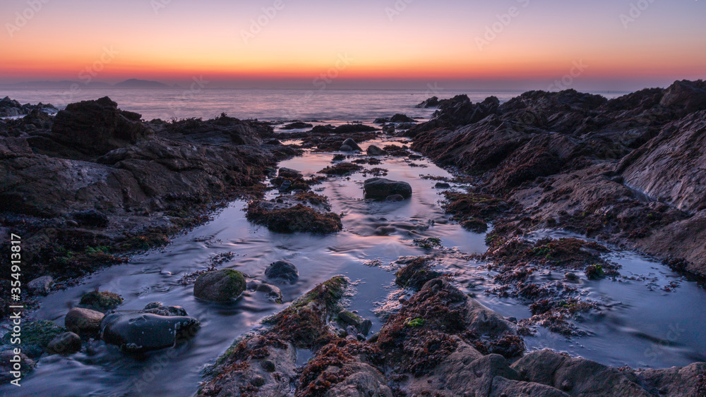 Sunrise over the sea in Guernsey.