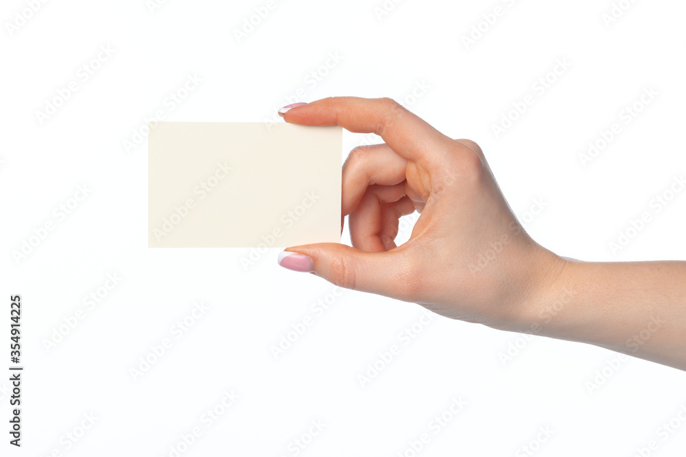 Female hand with blank white business card isolated on white Female hand with blank white business card isolated on white