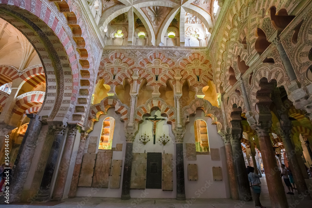 View of the columns and arches in the arabesque style inside the Mezquita, Cathedral of Córdoba, Spain.