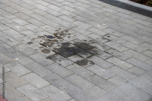 Motor Oil leaked on the cobblestone