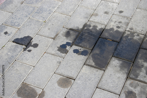 Motor Oil leaked on the cobblestone	