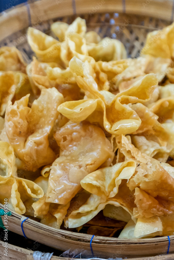Pangsit Goreng or fried Wonton or fried dumpling crispy. Filled with chicken or shrimp and served with chilli sauce. Pangsit Goreng or fried Wonton or fried dumpling crispy. Filled with chicken or shrimp and served with chilli sauce.