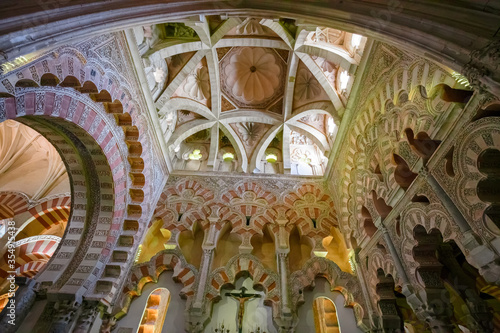 View of the columns and arches in the arabesque style inside the Mezquita, Cathedral of Córdoba, Spain. photo
