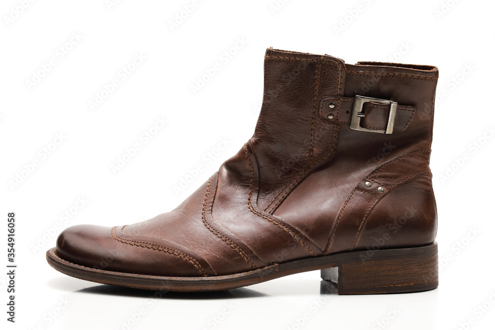 Two brown shoes with untied laces on a white isolated background