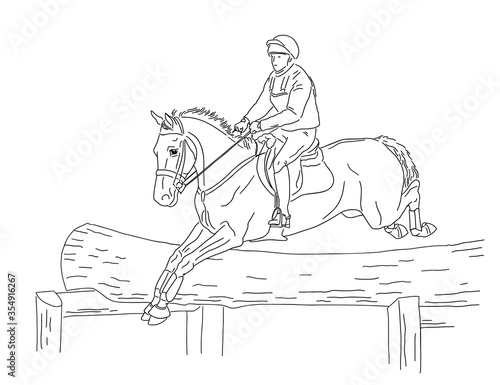 Horse jump over an tree-like obstacle during the eventing competition