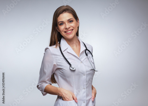 Smiling nurse in white uniform with stethoscope